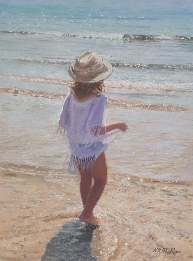 little girl looking forward to step into the sea