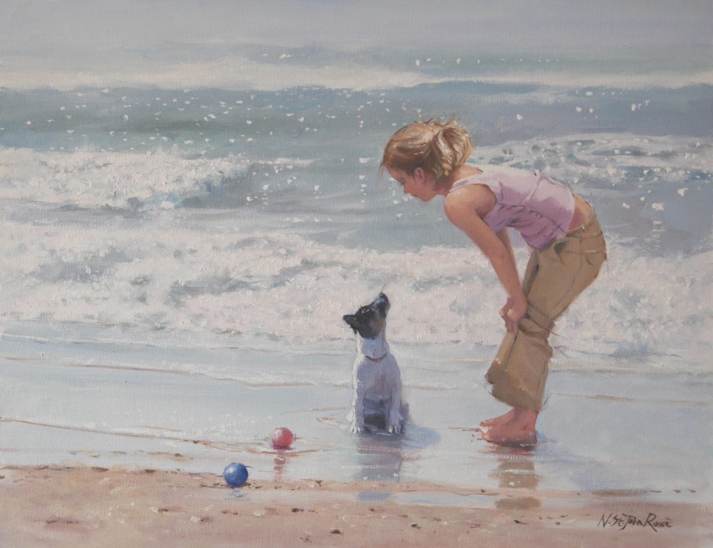 dog not sure which ball to chose to play with in the sea
