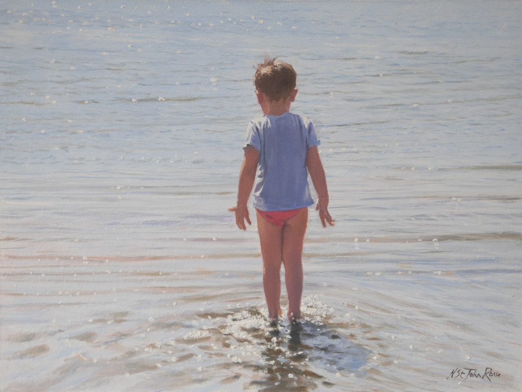 Boy's first steps in the refreshing sea